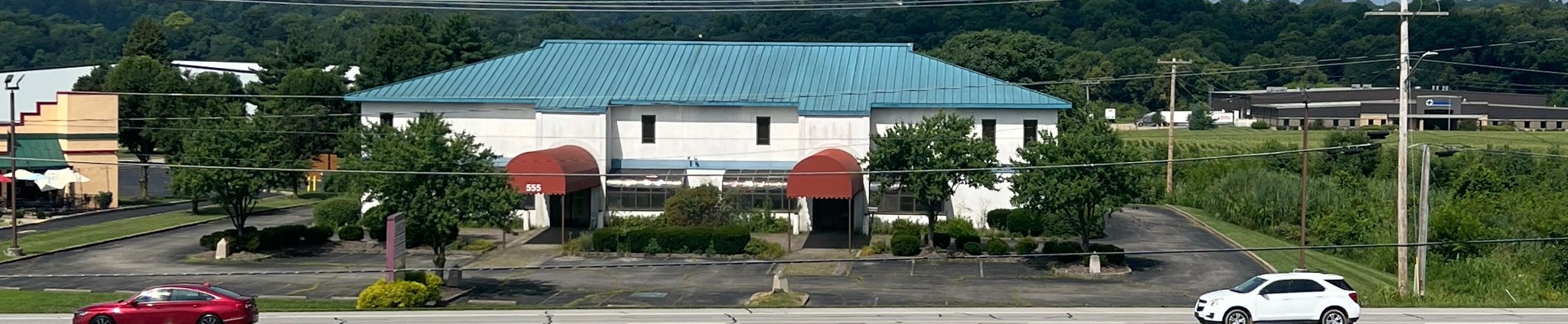 THE 555 at 555 E. Eads Parkway, Greendale, Indiana, photographed from across the road before renovation.